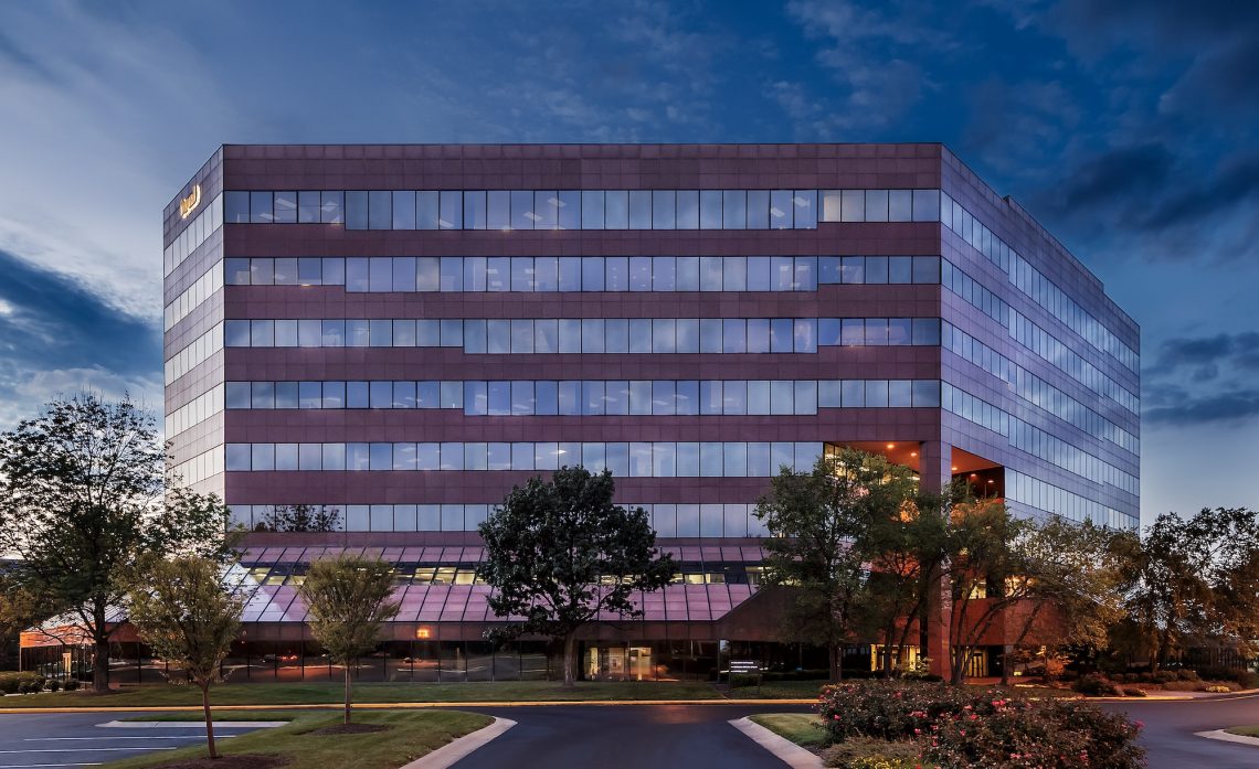 Exterior of the Zeller property Meridian Mark building front with treeline