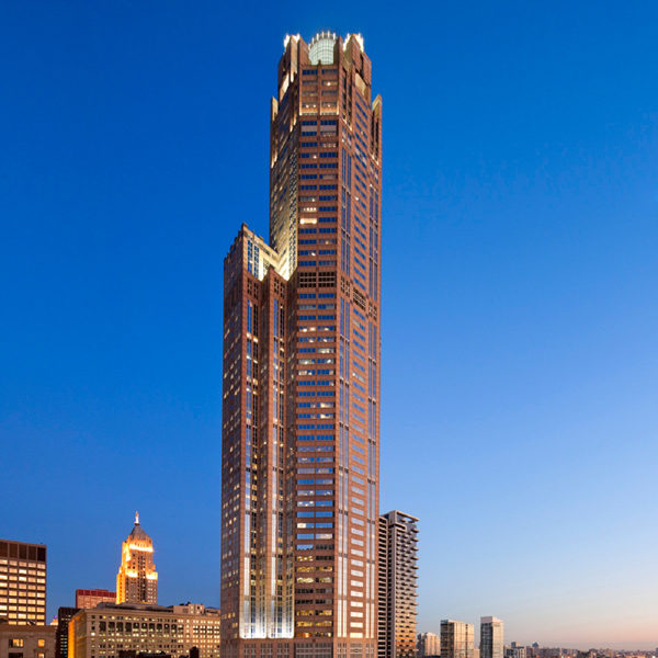 The full 311 South Wacker building, managed by Zeller, in Chicago, IL, at night with lights on.