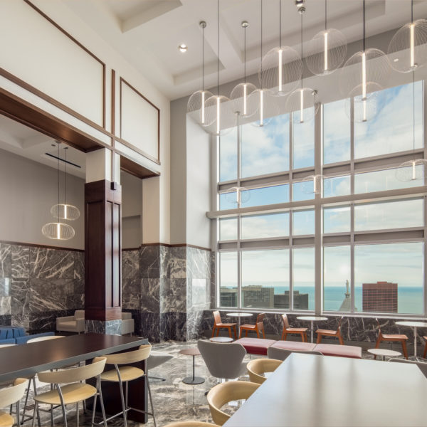 Office workers and an office suite with chairs at 311 South Wacker in Chicago, IL.