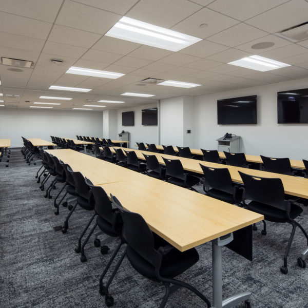 Empty conference room with long tables at Commerce Plaza in Oak Brook, IL, a Zeller office building.