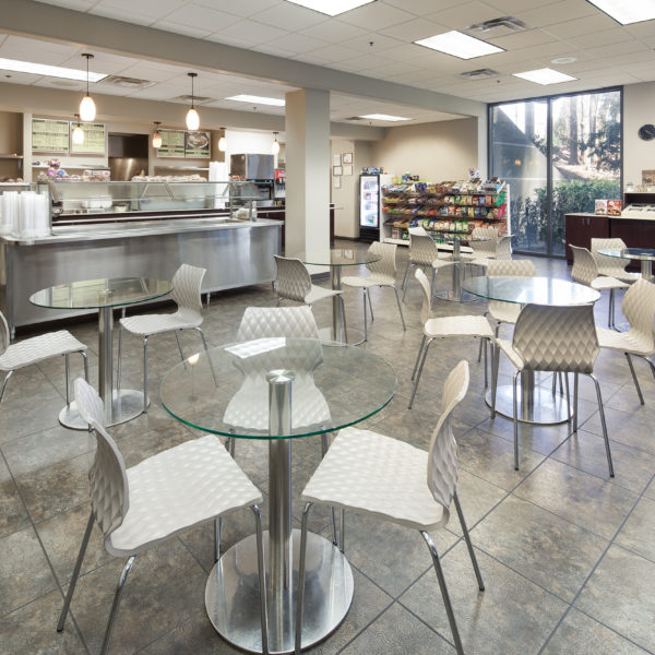 Chairs and glass tables in the cafe located at Premier Plaza in Atlanta.