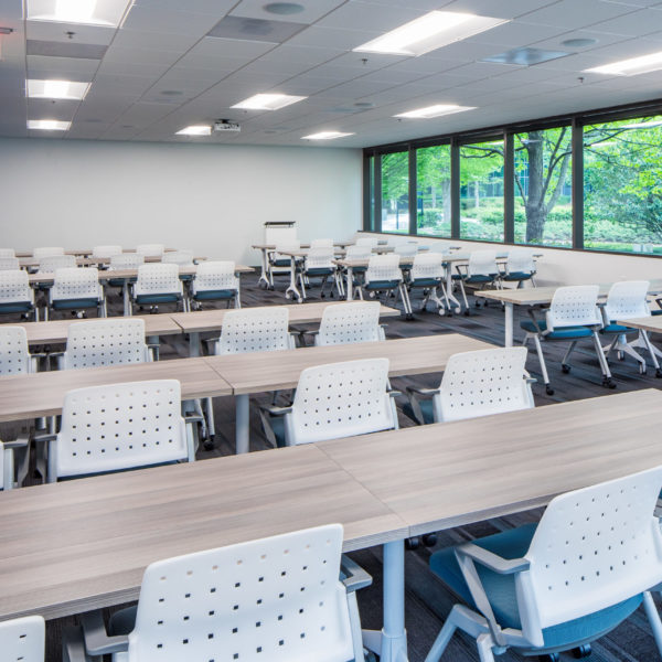 Empty conference room filled with chairs and tables at the Zeller managed Premier Plaza building in Atlanta, GA, scaled.